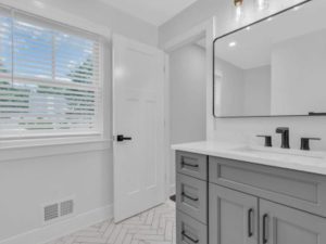 A beautifully lit bathroom, amidst a bathroom remodeling job